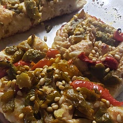 Topped with roasted peppers, caramelized onion cheddar & pine nuts!