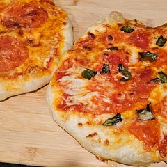 This is my go to fast pizza dough recipe. We make pizza once a week and add in garlic powder and basil.