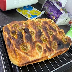 My first time making focaccia and it turned out so fluffy! My baking tray is quite small so the dough was quite thick and that's why the top is burnt.