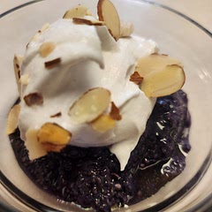 We served the pudding with a little bit of Maple syrup on top, and then put Coconut whipped topping on, with a few slivered almonds. So good! My sons loved it!