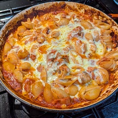 Came out pretty well, but can't really taste the chicken or bacon. Mostly tasted like the tomato sauce. I would use more chicken next time.
Cheddar was a little strange (but not awful) as some others said. Mozzarella next time.
Might help to cook the bacon first. It never got crispy. Grated the zucchini and carrot - no one in my family would eat it if they saw chunks of vegetables.
Was a bit heavy on oregano and vinegar because my 3 year old was helping and doesn't quite understand measuring spoons yet. That's not the recipe's fault!