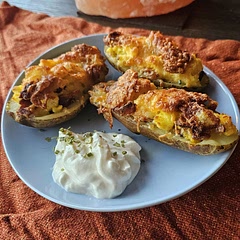Used an ice cream scooper to scoop out the center of the potatoes. Boil the potatoes for 20 minutes. Cook in the oven for 15 minutes at 400.