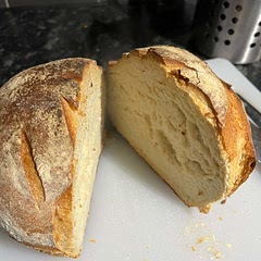 Crispy on the outside and soft on the inside. So easy and so good. Smells amazing. I made mine in a dutch oven pan as in the recipe and proved at room temp for 3 hours.
