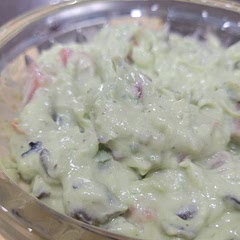 This is our favorite guacamole recipe. The lemon juice and sour cream help it last 2-3 days without browning. It's always a hit when we share it with others.
