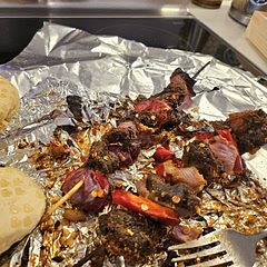 Made it extra spicy!! Remembered to take a pic after I devoured a stick lol, Coated one of it with peanut butter and Nigerian suya spice! Had it with jollof rice! It was so DELICIOUS!! Napped right after 😆😆