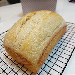 My 1st sourdough Sandwich Loaf. Added some dried oregano in the mixing. Baked in pullman tin with boiling water in oven, spray some water on top and score the dough. Came out perfect. 