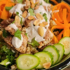 Over a bed of crisp greens, shredded cabbage. I served with quinoa, and topped with sliced carrots, cucumbers, Cilantro and peanuts! Also, I did half mayo half greek yogurt for the dressing and added EVOO to thin out a bit. 
