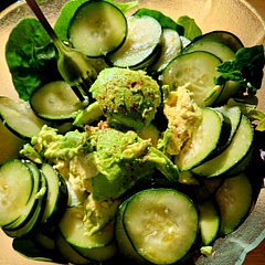 Served on a bed of spinach and mixed greens, topped with avocado