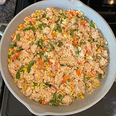 I added a bag of frozen mixed vegetables-microwaved them first while rice was cooking. Added extra rice too.
