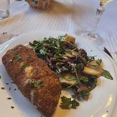 My inaugural attempt at preparing chicken kiev tonight is, in fact, not my first foray into making this classic dish. Having successfully prepared it multiple times in the past, I opted to pair it with an arguilar pear and candy walnut salad. A notable aspect of my initial attempt was the employment of a novel technique, wherein the kiev is deep-fried for two minutes to establish the desired color and texture. This approach has yielded favorable results, effectively containing the butter mixture within the chicken.