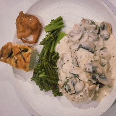 Delicious. Served with some greens, crispy chicken skin and homemade focaccia bread to mop up the delicious sauce.