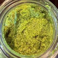 I made this from fresh basil from our garden and added spinach leaves I had on hand. This will be spread over top of chicken breast, fresh mozzarella and tomatoes baked in the oven and served ver Penne pasta! Yummy!!