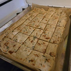 These were 1.5 cups of starter (my whole starter) 2 tbsp butter, 1/3 cup parmesan + chives from the garden baked 10 min at 325F and then scored.  Then,  baked for another 30 min. 