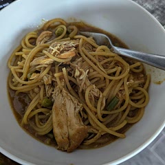 I called it "aggressively mediocre". It reminds me of the type of food you'd get from a frozen dinner at the grocery store. I think not cooking the chicken or onions first to brown them makes the entire dish feel uncooked. It was easy, but making curry on the stovetop is still better in my opinion. I also want rice and not noodles when I have curry