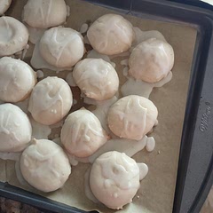I messed up the frosting this time; and added a wee bit of baking soda which gave them almost a meringue like texture and skin. I think some green coloring in the frosting might make them look slightly more appealing.
