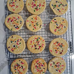 Flattened cookies a bit before baking & added sprinkles