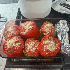 Doubled the recipe and used 3 green bell peppers and 3 large red bell peppers. Used 1 cup of dry rice cooked and about 1 1/4 lb of ground beef.  I also used a 30 oz can of whole Italian tomatoes.  I cooked it for 15 min then added pecorino romana cheese on top and cooked for a additional 15 min