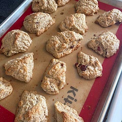 Added half almond extract, half vanilla. Mixed in cranberries and white chocolate chips. Laminated like pie crust to make layers.