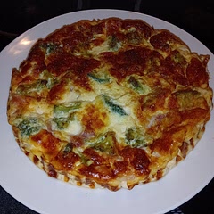 Add eggs... I did with 5 large, will try with 6 next time. Also as others have said I used about half the broccoli and didn't add salt. Recipe fit nicely in a 23cm round tin, wish our American friends would switch to metric already. 
Attempt 2, the one pictured includes a pot (170g) of cottage cheese. Didn't weigh the broccoli just plonked it around until it looked right.