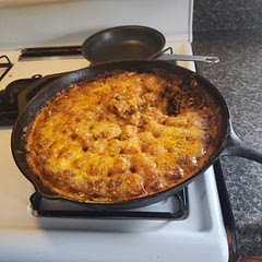 Left in cast iron pan and baked to give the cheese and extra crispness to in in the dish but otherwise delicious. 