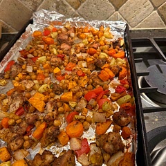 We loved this! This will become one of our regulars! I did add more veggies- 1 whole zucchini and 2 sweet potatoes. And used 1.8 pounds chicken thighs. Added   slightly more oil and spices.  Great flavors!  Made a quick white (Greek yogurt) sauce from a recipe called Food Cart-Style Chicken Salad with White Sauce by Skinny Taste.   You can eat as is or we also ate over yellow rice.  With the added veggies, we did use two roasting pans to spread things out.