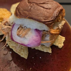 I tripled the recipe and cooked the still frozen chicken breasts in the pressure cooker with a cup of broth for 19 minutes, with a 10 minute natural release. I used much less bbq sauce and butter than was needed. Perfect!