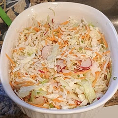 This is a much healthier coleslaw than traditional coleslaw, and it is so delicious! I've used this slaw for many other recipes that call for coleslaw. If you don't have time to shred your own cabbage, a pre-bagged coleslaw mix is great! 10/10