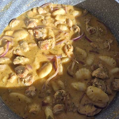 I boiled some leftover butternut squash and then puréed it. Used a variety of sausages, chilli & leek, turkey & Cumberland. Added the dried thyme, sage, garlic plus half a red onion and fennel to the sausage mix. Then the puree and stock. I used leftover cheese sauce from yesterday's roast instead of the cream.  I'm planning to bake it in the oven later.  It tastes delicious. 