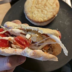 We decided to cut the pita and stick everything in, and although it was pretty messy, it was delicious. One thing I changed: I added two spoons of 10% fat Greek yogurt (for the normal 10 servings) to the chicken marinade. It made the whole thing juicier. 