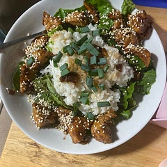 Put on bed of lettuce rice in the middle and chicken surrounding rice