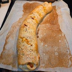 Very tasty! Made a meat sauce to spread inside the Stromboli. Consisted of seasoned (salt, pepper, onion powder, minced garlic and Italian seasoning) and browned ground beef in marinara sauce. Used half pepperoni and half mushroom. Had a mix of shredded provolone and mozzarella. Rolled up and sealed then  brushed with beaten egg/water and sprinkled with Italian seasoning and fresh grated Parmesan cheese before slitting through the top.