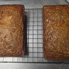 Made a double batch my first time out with this one, went heavy on the sugar as offered by the recipe, also added 1/2C Semisweet chocolate chips and 1/2C Chopped Walnuts per loaf. Went light on the mixing to avoid over-mixing then cooked as suggested and it came out perfect. Served with a bit of cream cheese to balance out the sweetness of the banana bread and the bitter of the chocolate