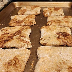 I accidentally added 1 cup instead of 1/2 cup of milk, so I more or less doubled the dough recipe (didn't add the extra 1/2 cup of water). I still ended up kneading in a fair bit more flour to make it not too sticky. I made one batch with the called- for filling and one batch with a light coating of olive oil instead of butter, about a tablespoon of chopped fresh oregano, thyme and rosemary, and 1 oz of grated Parmesan. They came out a little dry, and the sweet ones weren't as flavorful as expected. This is a solid starting recipe and really not as hard as I expected! Next time,  probably add more filling and put parchment paper or silicone mat on the baking sheets to prevent sticking. 
