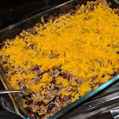 Had some cooked taco meat I used instead of chicken, and I just added it to the dish the last fifteen minutes or so after the rice cooked with everything for 45 minutes. Mixed the beef in, then topped with the cheese and served with sour cream and chips for the kids to devour. I added salsa to mine. Super easy and everyone from 1-year-old to the adults cleared the plates. 