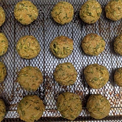 I made a double batch because I hate having partial tofu blocks and had plenty of zucchini. I must have made the balls too big as I only got 19, and they did need a little more cook time. They could use more garlic and probably more of the other spices, and I think half the baking powder as I'd prefer them a little more dense/less fluffy. Lovely little balls for snacking or have more and call it a meal. 