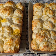 Added some Italian seasoning, garlic, and onion powder. It smells heavenly. In lieu of a Dutch loaf. I used my bread pans. I tore the dough into balls and gave it a dip in melted butter and tossed them in the pans. (Think pull apart method) Delicious 