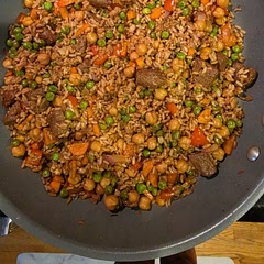Delicious, and the next day this dish is just as yummy, if not even tastier.
Since the ingredients and cooking instructions did not align I did go with brown rice and chickpeas. I used red peppers instead of broccoli, and I added plant-based steak pieces, which were an excellent choice. 
