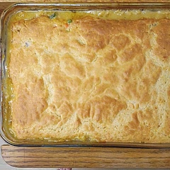 This is an 'okay' recipe with a few tweaks. 1) I probably used 5 cups of chicken, cubed. 2) I added 1/2 tsp of dried thyme, dried parsley and poultry seasoning 3) I only used about 13 oz. of chicken broth instead of 16 oz. 4) I added the biscuit seasoning packet into the dough. I'd rather have that flavor throughout the dough than just dressed on top. 5) I added half the seasoning to the soup mixture and half I mix with the chicken. If I make this again I'll up the seasoning throughout, including seasoning the biscuit mix. I wasn't over excited about the "gravy" it made. Not enough taste or substance. Might try doing half broth and half heavy cream next time. So I thought about this for a few days and I decided it is too much work for very little flavor. I'll just stick with traditional pot pie.

