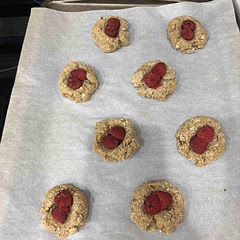 I didn’t expect these to be so good! I doubled the recipe and got 16 cookies out of it.

Slight modifications I made for my own taste:
1. I ground the oats in my coffee grinder to make the texture a little less chewy.
2. Instead of mixing the raspberries in, I made thumbprints in the cookies and nestled the berries in the holes.

The dough is a little bland so next time I will probably add a tablespoon of agave or maple syrup.