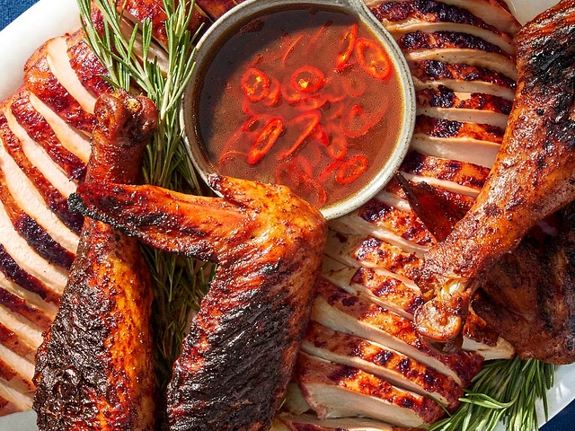 I started grilling my turkey last year using this recipe, and it massively reduces the cook time to do it this way. Frees you up to focus on all the other dishes you're preparing day of.