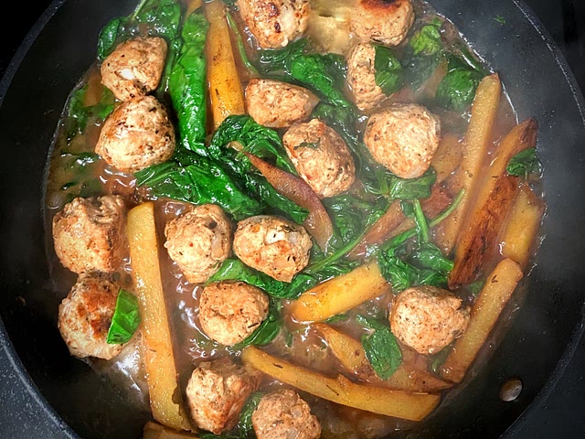 Rustic turkey meatballs with golden potatoes and spinach in buttery brown sauce, served with brown rice not pictured