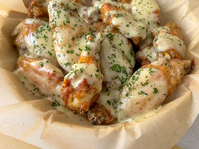 Hi, it's Creamy Garlic Parmesan Chicken Wings for me! 