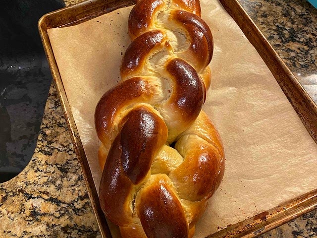 I’ve made this by hand and by stand mixer many times! If your making it by hand knead the dough for about 10 minutes give or take until smooth and elastic. If by stand mixer, just 5 minutes. You can check if the dough is ready with the windowpane method (quick google search should help)!
