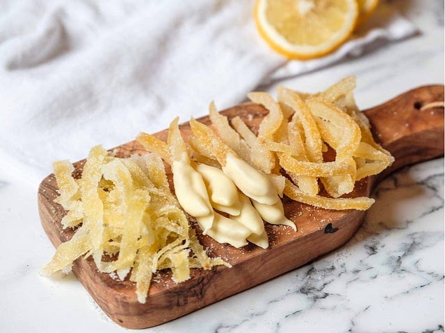 Zest is used to infuse citrus flavor into a variety of dishes! And there is difference between zest, peel and rind. Zest is colored outer layer of the skin (yellow part). Rind includes the zest and just a bit of the bitter white under layer, if you want to have bitterish flavor it is great option! Peel is whole jacket (yellow + white part) - everything but the flesh. I looooove them candied.