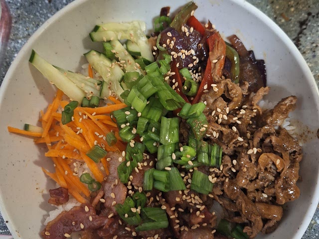 I highly recommend rice bowls. Really simple because all it takes is rice + whatever you have in the fridge. Ours are usually kimchi, meat (whatever we have) marinated in basically soy sauce sugar, a few pepper flakes, garlic, and ginger, two vegetables (again whatever we have). Often nuts and avocados are added. You can also make it with meat seasoned with taco seasoning for example and add corn and beans and avocados, etc. There are many different ways to prepare rice bowls and it just uses up what you have.

(I promise! There's rice under there haha)