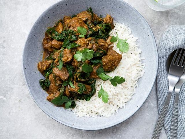 I would suggest this recipe.  you can replace regular curry powder with mild one and also you can add extra veggie, coconut milk, cream or yogurt to make it less spicier 🙂