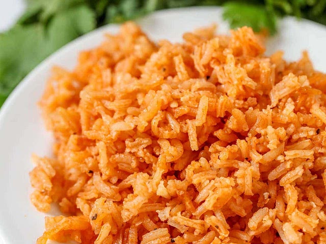 Here's one idea: I like to make this spanish rice and do "burrito bowls" - you can make taco meat or grilled chicken, and whatever toppings you like (salsa/pico de gallo, cole slaw/lettuce, cheese, olives, etc) and everyone gets to build their own dish.