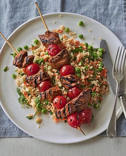 Spiced lamb kebabs with pea & herb couscous