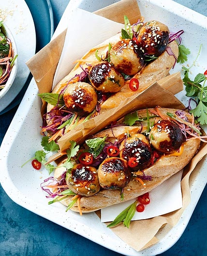 Honey-glazed miso chicken meatball subs with rainbow slaw