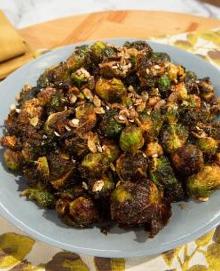 Fried Brussels Sprouts with Apple Reduction and Candied Pumpkin Seeds
